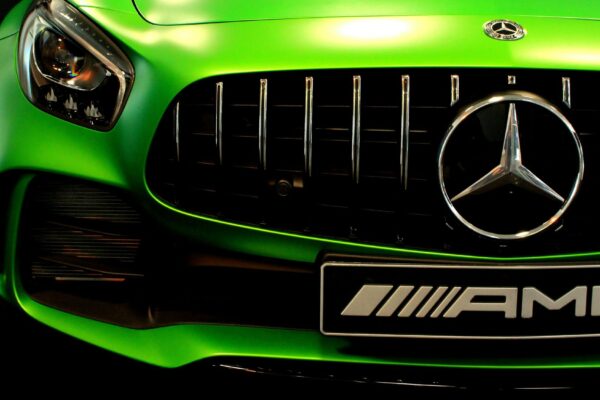 A green Mercedez AMG car closeup shot showcasing latest car exterior mods